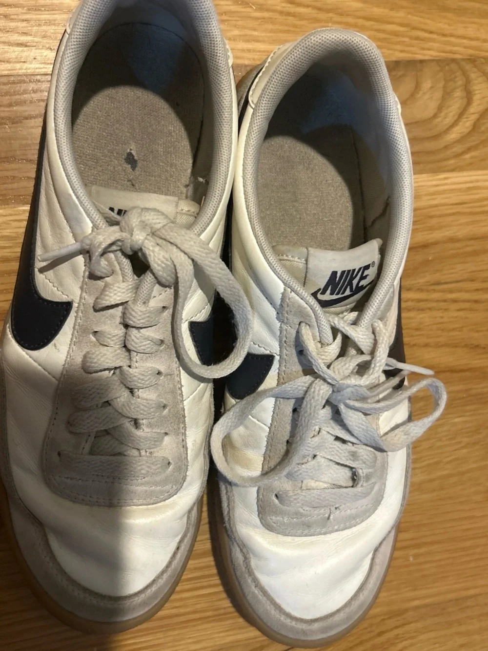Nike Women's White Sneakers with Black Swoosh